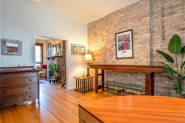3711 N Pine Grove Ave Unit 2Nw, Chicago, IL 60613 - sitting room featuring a fireplace, hardwood / wood-style floors, and brick wall