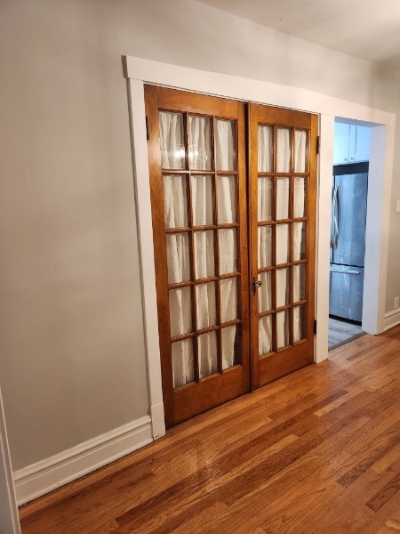 2250 N Dayton St Unit 3, Chicago, IL 60614 - detailed view of freestanding refrigerator, wood finished floors, and french doors