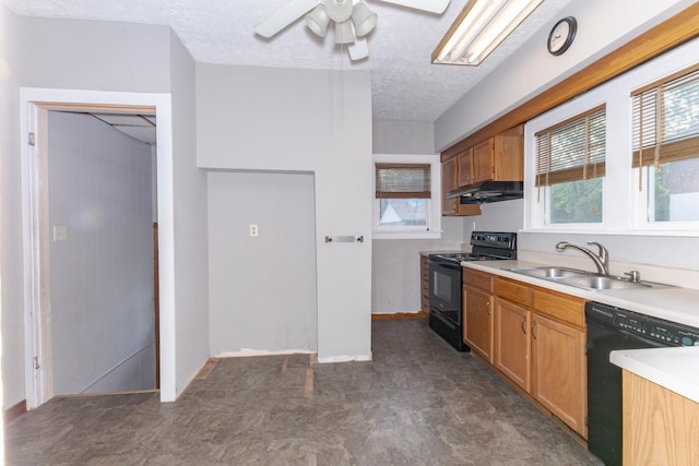 217 W Moulton St, Pontiac, IL 61764 - kitchen featuring black appliances, under cabinet range hood, ceiling fan, light countertops, and plenty of natural light