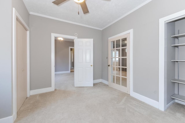 217 W Moulton St, Pontiac, IL 61764 - unfurnished bedroom with carpet flooring, crown molding, a textured ceiling, and a ceiling fan
