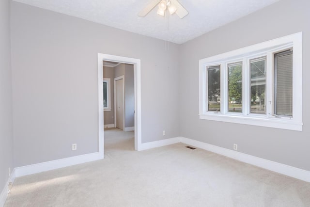 217 W Moulton St, Pontiac, IL 61764 - empty room featuring light colored carpet and ceiling fan