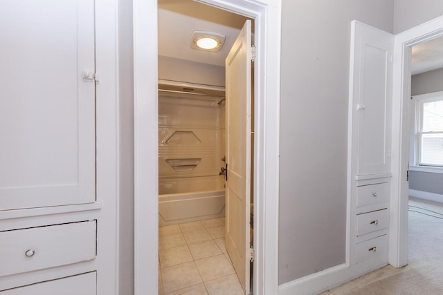 217 W Moulton St, Pontiac, IL 61764 - bathroom featuring tile patterned flooring and washtub / shower combination