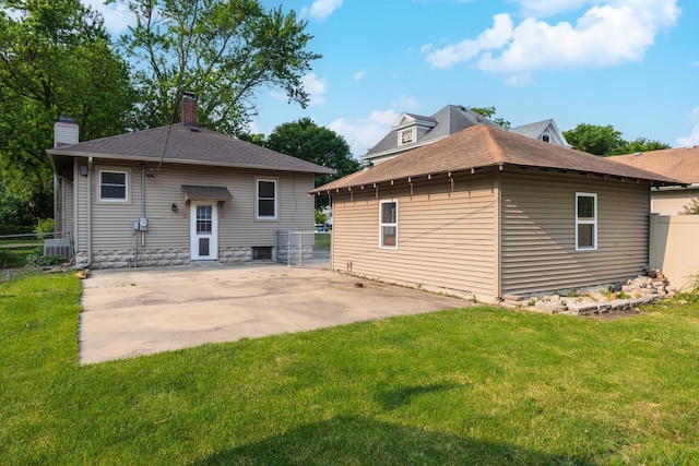 217 W Moulton St, Pontiac, IL 61764 - rear view of property with a patio, a chimney, and roof with shingles