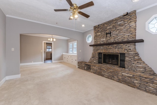 217 W Moulton St, Pontiac, IL 61764 - unfurnished living room featuring carpet, arched walkways, ceiling fan, a chandelier, and ornamental molding
