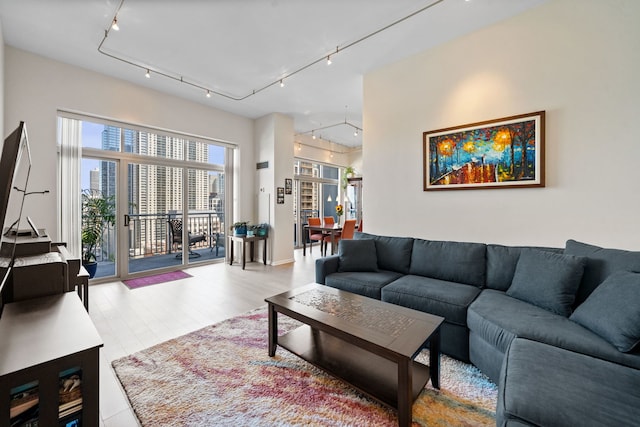 600 N Dearborn St Unit 2005, Chicago, IL 60654 - living area featuring track lighting, a view of city, and wood finished floors