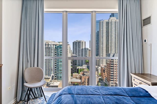 600 N Dearborn St Unit 2005, Chicago, IL 60654 - bedroom with a view of skyline and baseboards