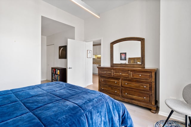 600 N Dearborn St Unit 2005, Chicago, IL 60654 - bedroom with light wood-style floors, baseboards, and a towering ceiling