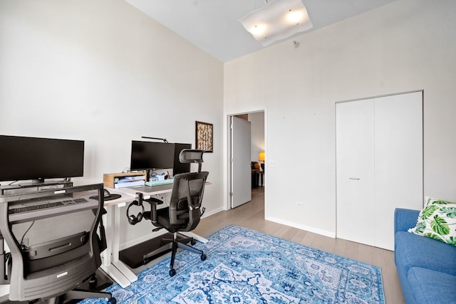 600 N Dearborn St Unit 2005, Chicago, IL 60654 - office area featuring wood finished floors, a high ceiling, and baseboards