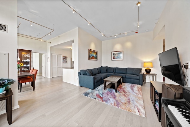 600 N Dearborn St Unit 2005, Chicago, IL 60654 - living area featuring rail lighting, attic access, and light wood-style floors