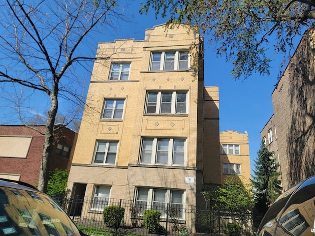 4104 N Mozart St Unit Ge, Chicago, IL 60618 - view of apartment building / complex with a fenced front yard