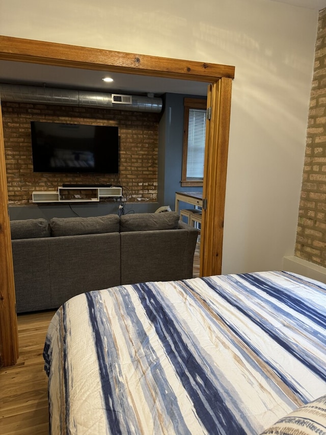 4104 N Mozart St Unit Ge, Chicago, IL 60618 - bedroom featuring wood finished floors and brick wall