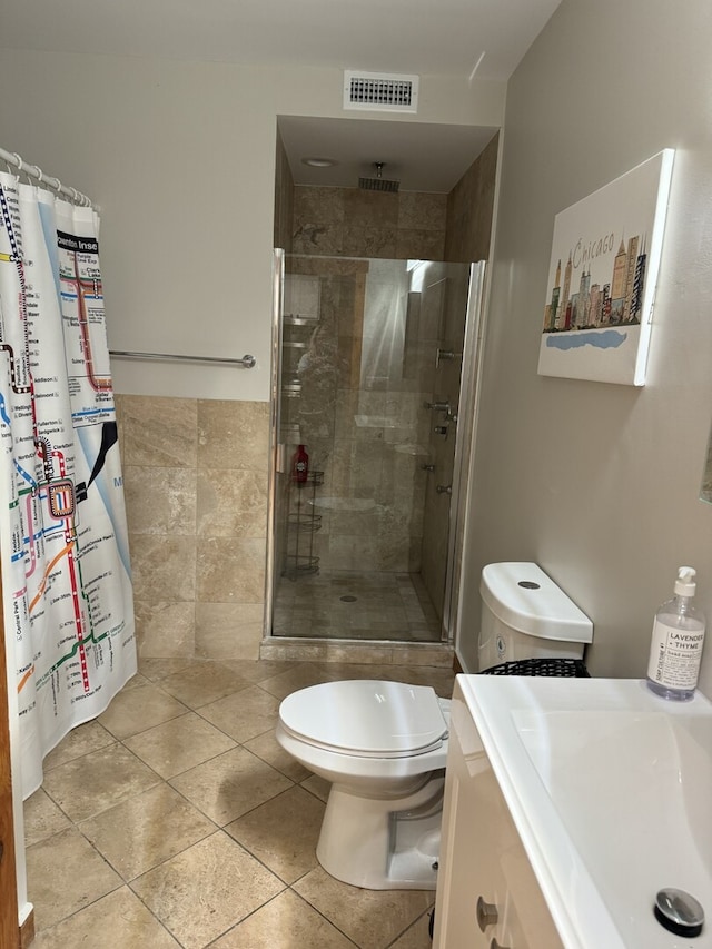 4104 N Mozart St Unit Ge, Chicago, IL 60618 - full bath featuring a shower stall, tile patterned flooring, toilet, and vanity