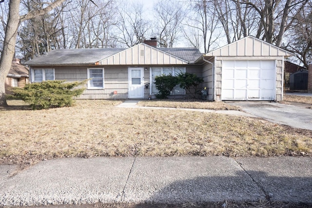 347 Manitowac St, Park Forest, IL 60466 - ranch-style house with a chimney, asphalt driveway, an attached garage, and board and batten siding