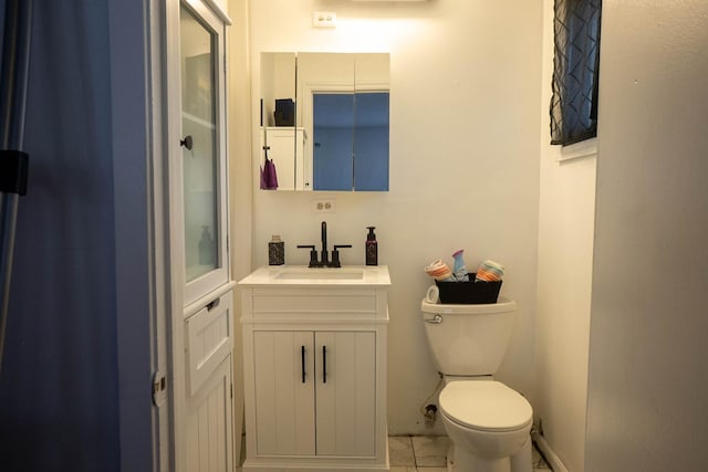 347 Manitowac St, Park Forest, IL 60466 - bathroom with marble look tiles, vanity, toilet, and baseboards