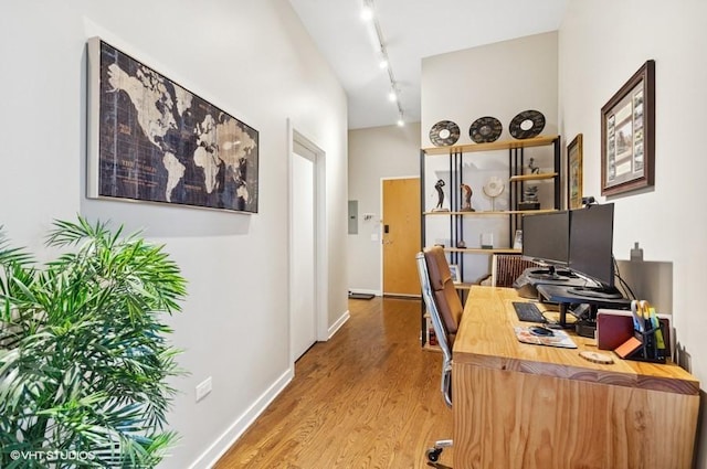 4011 N Francisco Ave Unit 301, Chicago, IL 60618 - home office featuring wood finished floors, rail lighting, and baseboards