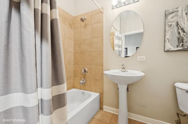 4011 N Francisco Ave Unit 301, Chicago, IL 60618 - bathroom featuring shower / tub combo with curtain, tile patterned flooring, toilet, and baseboards