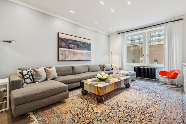 209 E Lake Shore Dr Unit 3W, Chicago, IL 60611 - living room featuring radiator heating unit, wood finished floors, and ornamental molding