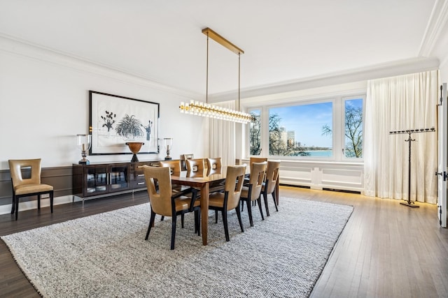 209 E Lake Shore Dr Unit 3W, Chicago, IL 60611 - dining room featuring ornamental molding and wood finished floors