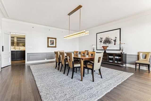 209 E Lake Shore Dr Unit 3W, Chicago, IL 60611 - dining area with dark wood-style flooring, ornamental molding, a decorative wall, and a wainscoted wall
