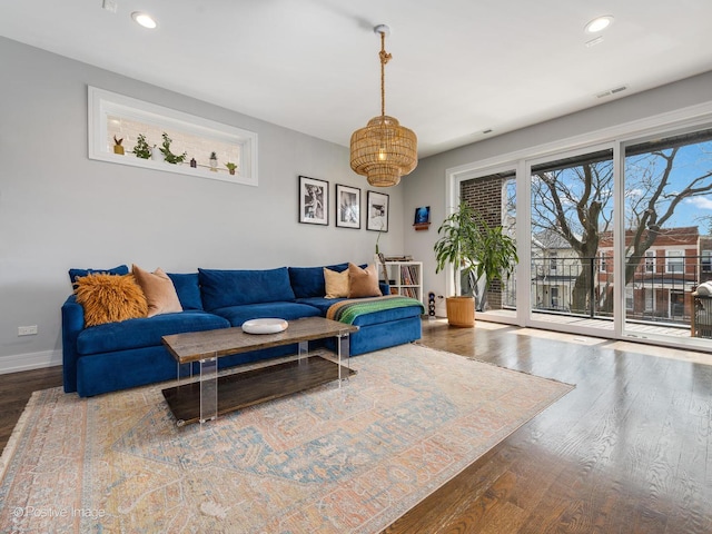 2422 W Lyndale St Unit 2, Chicago, IL 60647 - living area featuring wood finished floors, baseboards, recessed lighting, and a chandelier