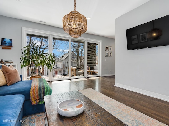 2422 W Lyndale St Unit 2, Chicago, IL 60647 - living room with a chandelier, baseboards, wood finished floors, and recessed lighting