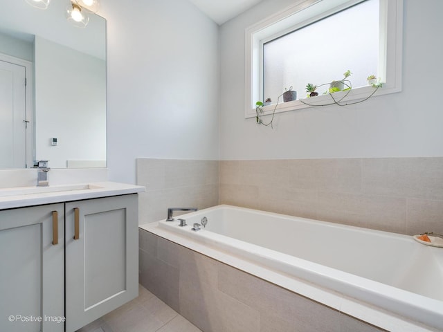 2422 W Lyndale St Unit 2, Chicago, IL 60647 - full bath featuring vanity, a bath, and tile patterned floors