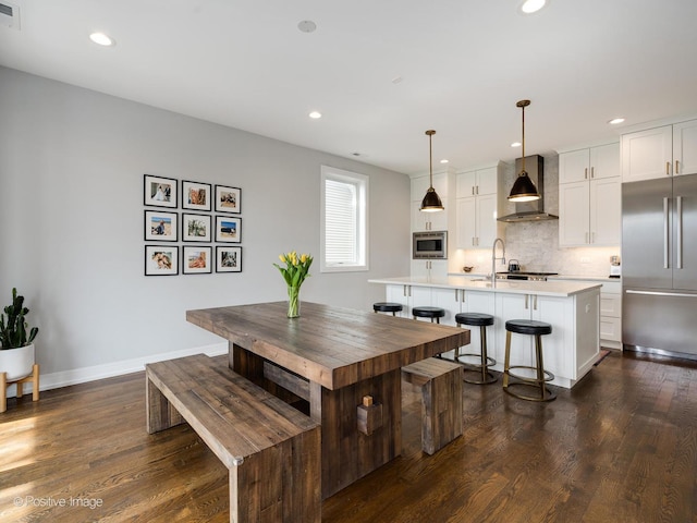 2422 W Lyndale St Unit 2, Chicago, IL 60647 - dining room featuring dark wood-style flooring, baseboards, and recessed lighting