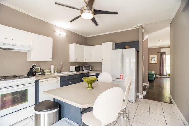 1663 W Farwell Ave, Chicago, IL 60626 - kitchen with white appliances, a sink, under cabinet range hood, light countertops, and white cabinetry
