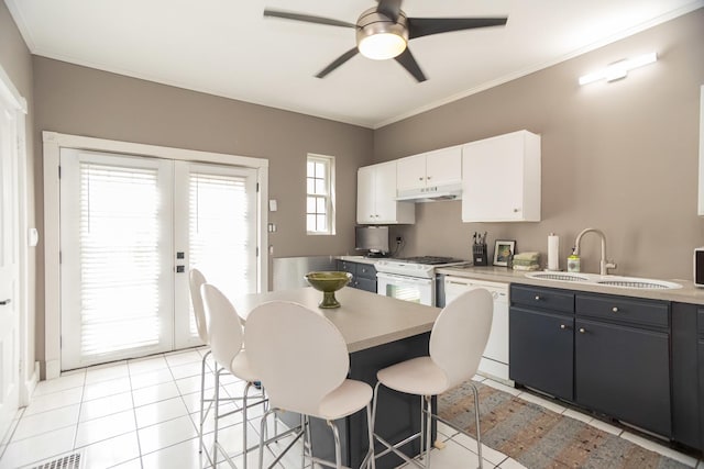 1663 W Farwell Ave, Chicago, IL 60626 - kitchen with white appliances, a sink, under cabinet range hood, ceiling fan, and light countertops