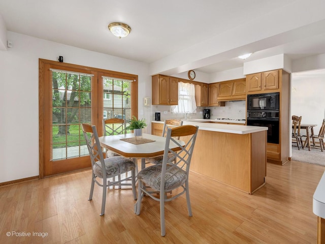7514 Nantucket Dr, Darien, IL 60561 - dining area featuring light wood-style flooring and baseboards