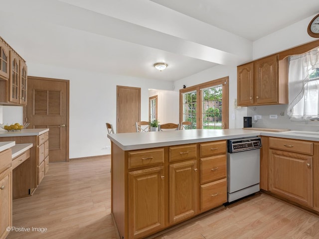 7514 Nantucket Dr, Darien, IL 60561 - kitchen featuring dishwasher, light wood-type flooring, a peninsula, light countertops, and glass insert cabinets