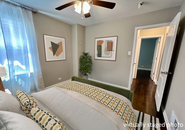 8920 S Jeffery Blvd, Chicago, IL 60617 - bedroom with wood finished floors, baseboards, and ceiling fan