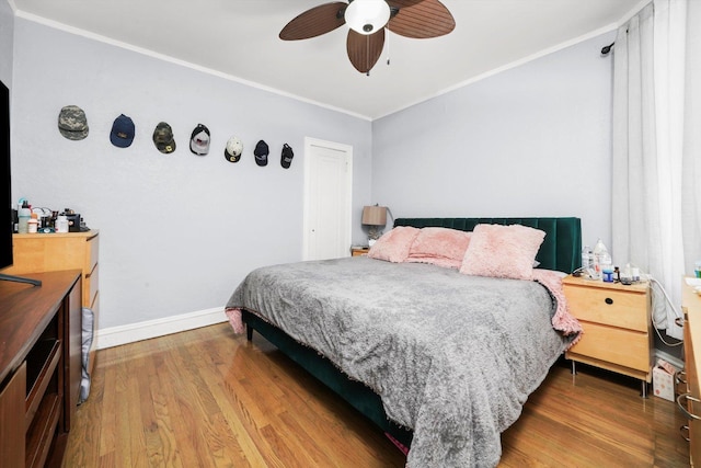 10807 S Wentworth Ave, Chicago, IL 60628 - bedroom with crown molding, wood finished floors, and ceiling fan
