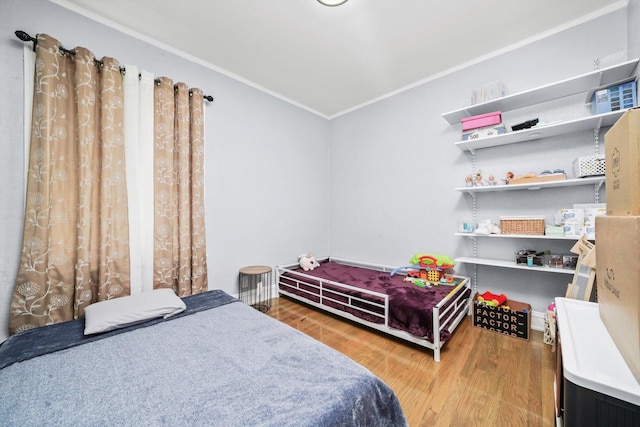 10807 S Wentworth Ave, Chicago, IL 60628 - bedroom featuring crown molding and wood finished floors