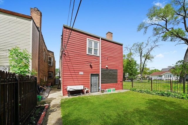 10807 S Wentworth Ave, Chicago, IL 60628 - back of property with a chimney
