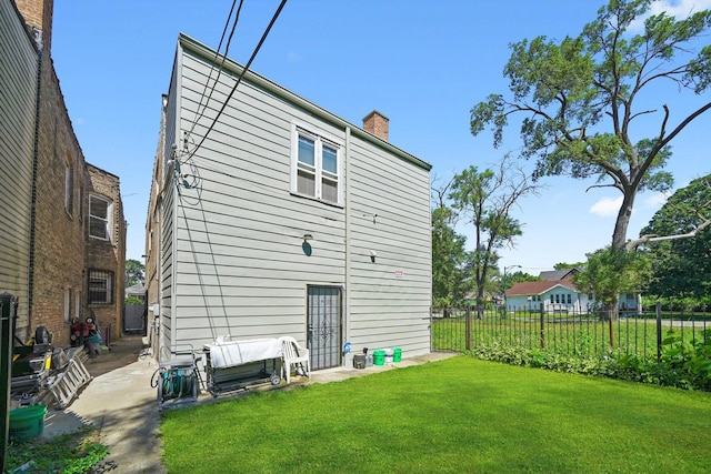 10807 S Wentworth Ave, Chicago, IL 60628 - back of house featuring a chimney