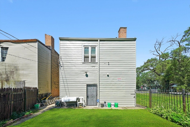 10807 S Wentworth Ave, Chicago, IL 60628 - back of house with a chimney