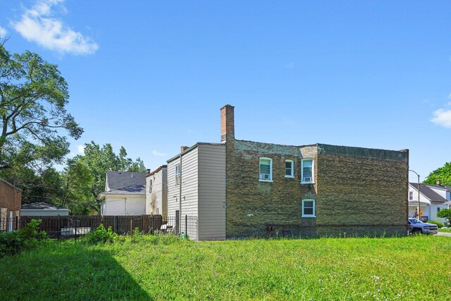 10807 S Wentworth Ave, Chicago, IL 60628 - view of home's exterior with a chimney