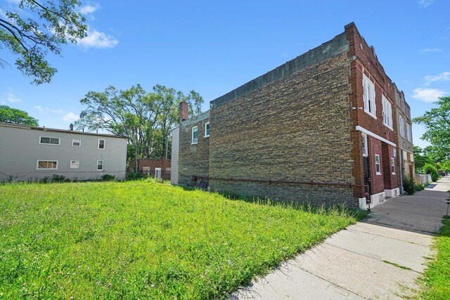 10807 S Wentworth Ave, Chicago, IL 60628 - view of property exterior featuring brick siding