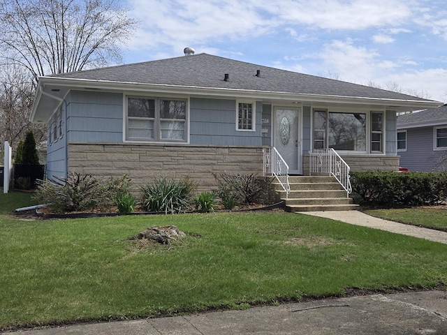 18433 Arcadia St, Lansing, IL 60438 - view of front facade with stone siding, a front yard, and a shingled roof