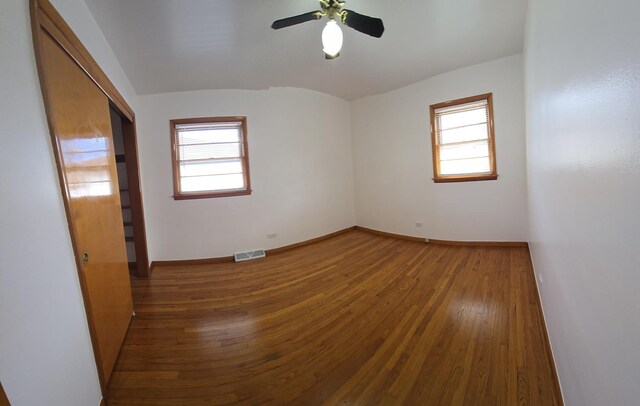 18433 Arcadia St, Lansing, IL 60438 - unfurnished room featuring plenty of natural light, wood finished floors, a ceiling fan, and baseboards