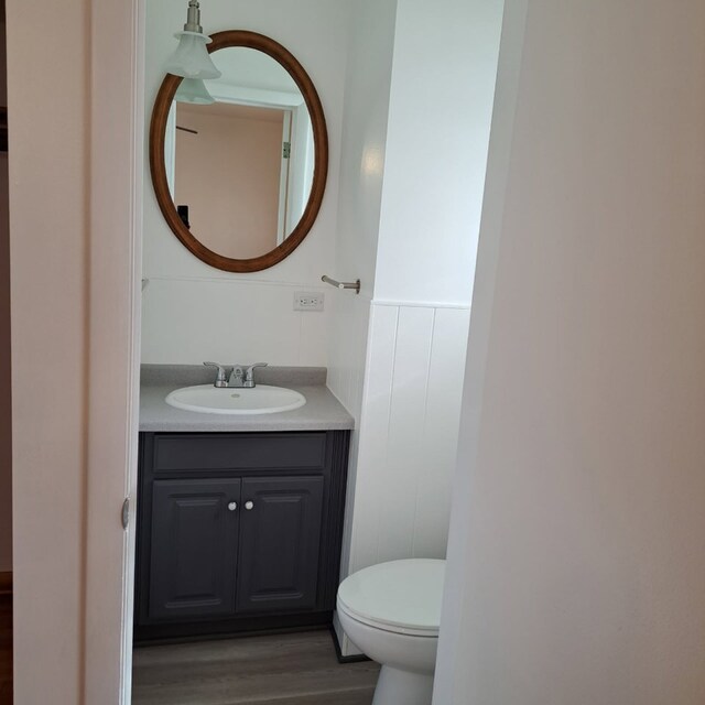 18433 Arcadia St, Lansing, IL 60438 - half bathroom with vanity, wood finished floors, and toilet