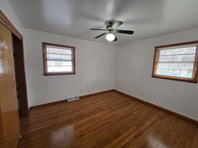 18433 Arcadia St, Lansing, IL 60438 - spare room with wood finished floors, baseboards, and a ceiling fan