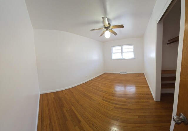 18433 Arcadia St, Lansing, IL 60438 - unfurnished bedroom featuring wood finished floors, baseboards, and a ceiling fan