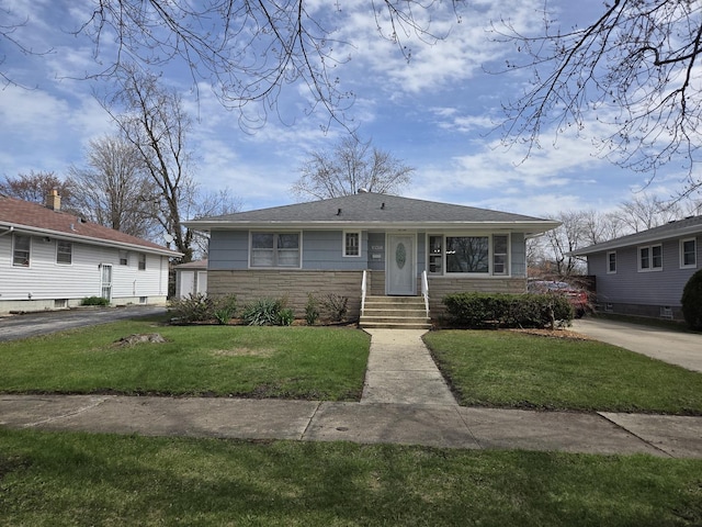 18433 Arcadia St, Lansing, IL 60438 - view of front facade with entry steps, a front lawn, and stone siding