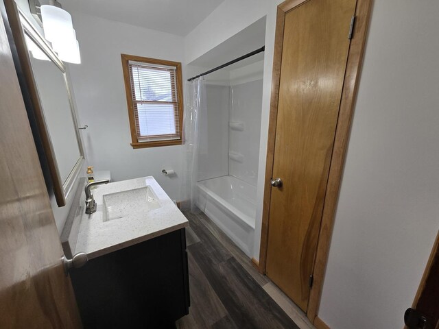 18433 Arcadia St, Lansing, IL 60438 - bathroom featuring vanity, wood finished floors, and shower / tub combo