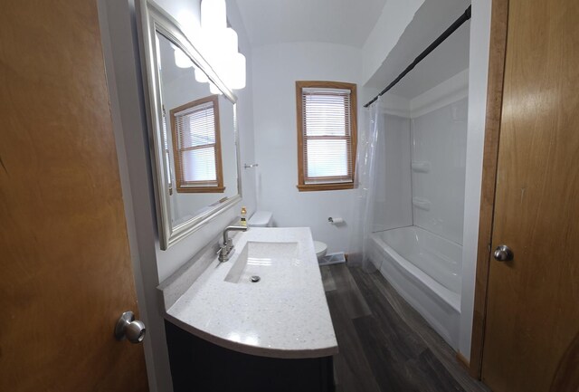 18433 Arcadia St, Lansing, IL 60438 - full bathroom featuring wood finished floors, toilet, vanity, and shower / bath combo