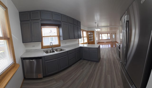 18433 Arcadia St, Lansing, IL 60438 - kitchen with appliances with stainless steel finishes, a sink, light countertops, dark wood-style floors, and gray cabinetry