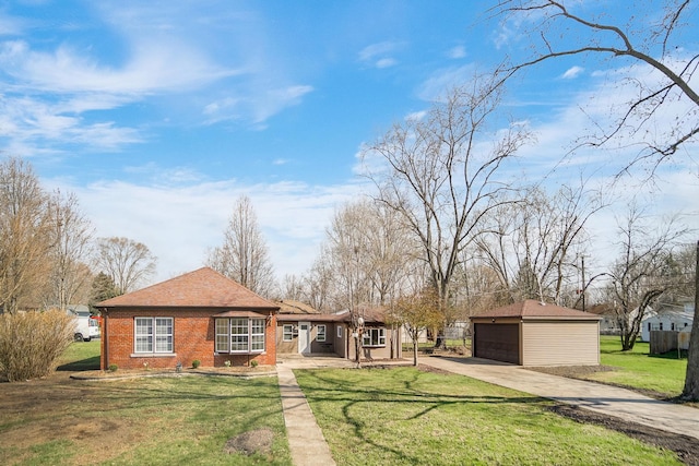 21967 Millard Ave, Richton Park, IL 60471 - back of property featuring an outbuilding, brick siding, a lawn, and driveway