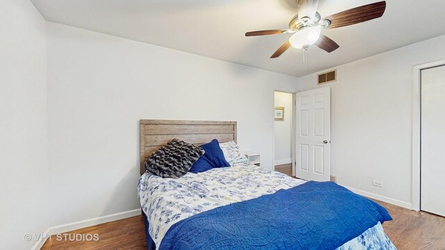 24452 W Blvd Dejohn, Naperville, IL 60564 - bedroom featuring baseboards, wood finished floors, and a ceiling fan